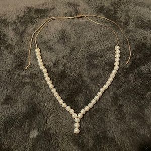 Pearl necklace with adjustable chain.